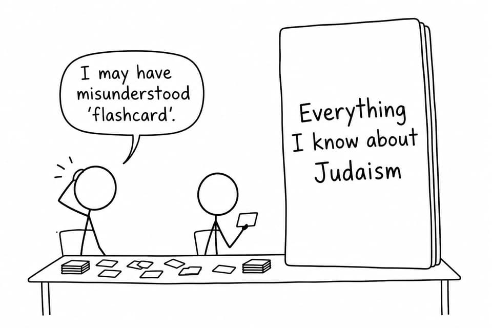 Two students compare a normal revision card with an enormous card labelled as everything known about Judaism.