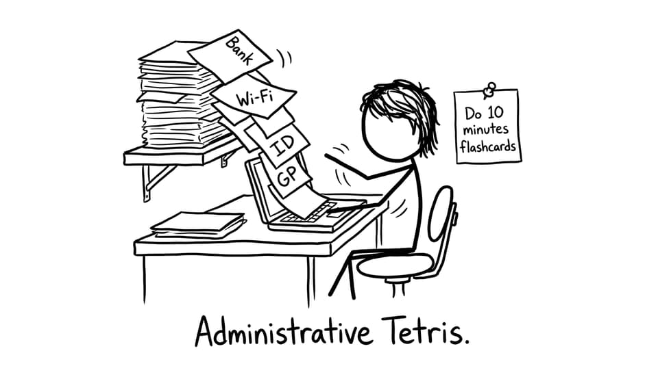 A dorm desk with forms sliding onto the keyboard